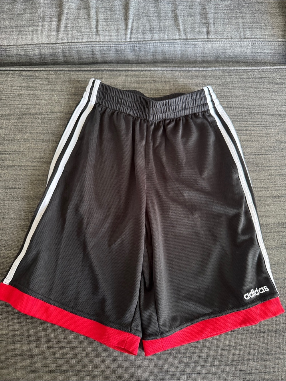 adidas Black Athletic Shorts with White Stripes and Red Hem